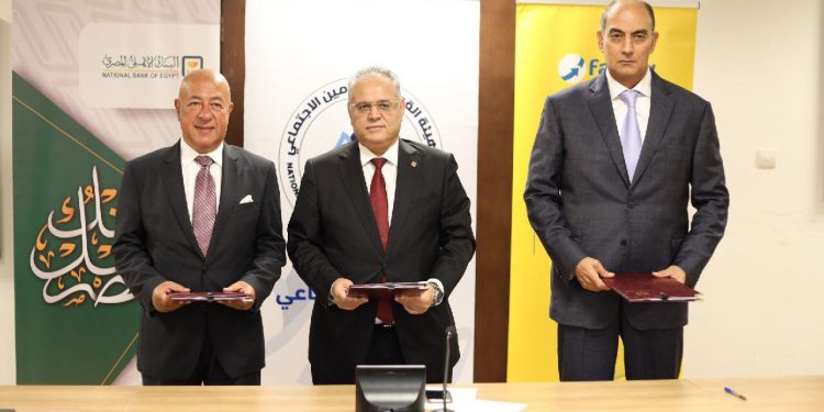 بروتوكول تعاون بين التأمينات الاجتماعية والبنك الأهلي وفوري لتفعيل منظومة الدفع الإلكتروني